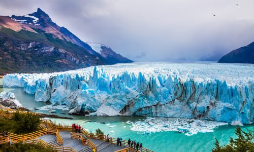 Grandiose glacier Perito Moreno in the Argentine part of Patagonia. The concept of ecological and extreme tourism. Large and comfortable observation deck for tourists